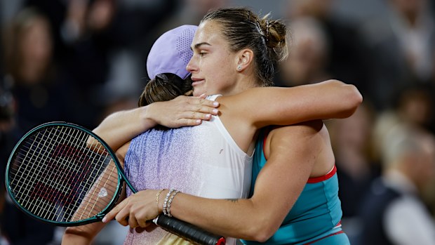 Aryna Sabalenka and Iga Swiatek at the net after their gruelling three-set semi-final battle at Roland-Garros. 