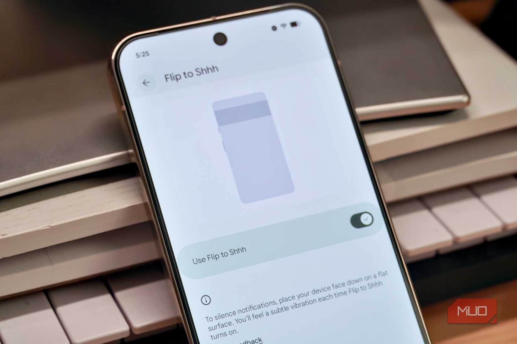 Turning on the Flip to Shhh feature on a Pixel phone.