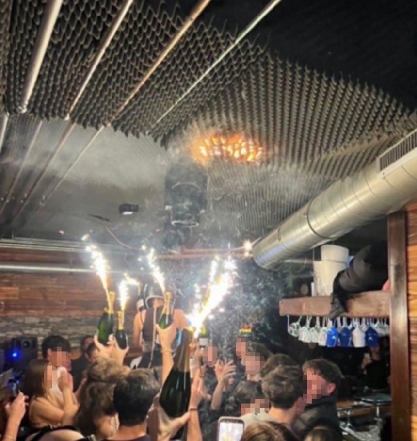 Another image shows the ceiling on fire. A portion of this image was blurred by CNN to protect identities.