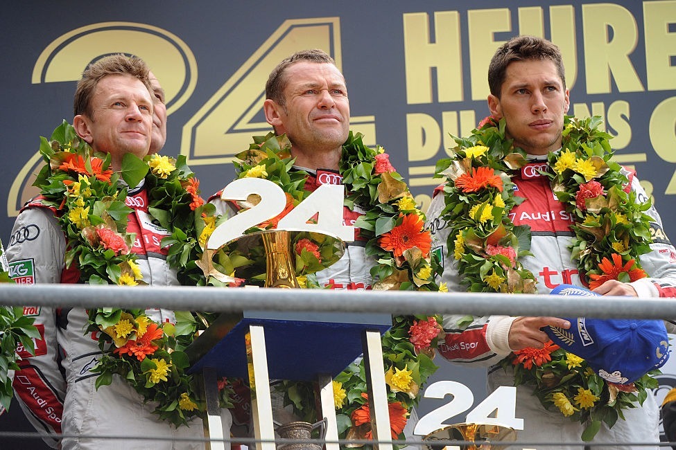 Allan McNish (left, with Tom Kristensen and Loic Duval) claimed his third Le Mans victory in 2013