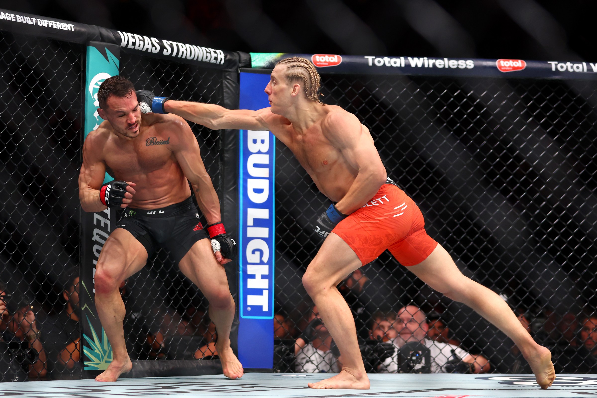 MIAMI, FLORIDA - APRIL 12: Paddy Pimblett of England (R) punches Michael Chandler of the United States in a lightweight fight during UFC 314 at Kaseya Center on April 12, 2025 in Miami, Florida. (Photo by Megan Briggs/Getty Images)