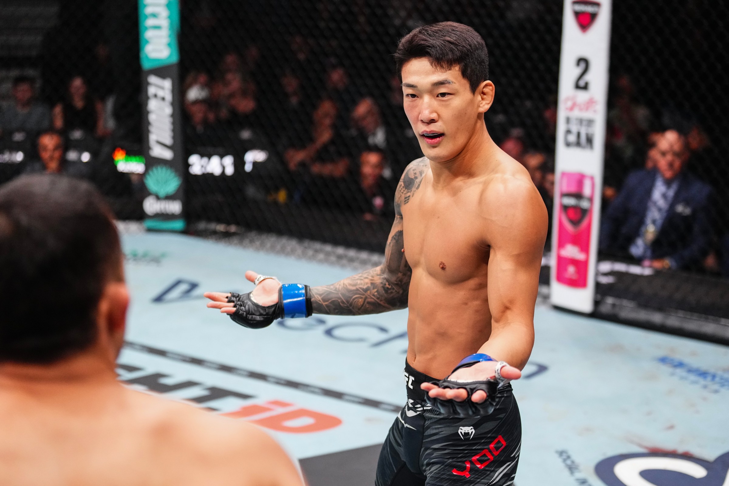 LAS VEGAS, NEVADA - OCTOBER 04: (R-L) JooSang Yoo of South Korea ineteracts with Daniel Santos of Brazil in a 153-pound catchweight fight during the UFC 320 event at T-Mobile Arena on October 04, 2025 in Las Vegas, Nevada. (Photo by Jeff Bottari/Zuffa LLC)
