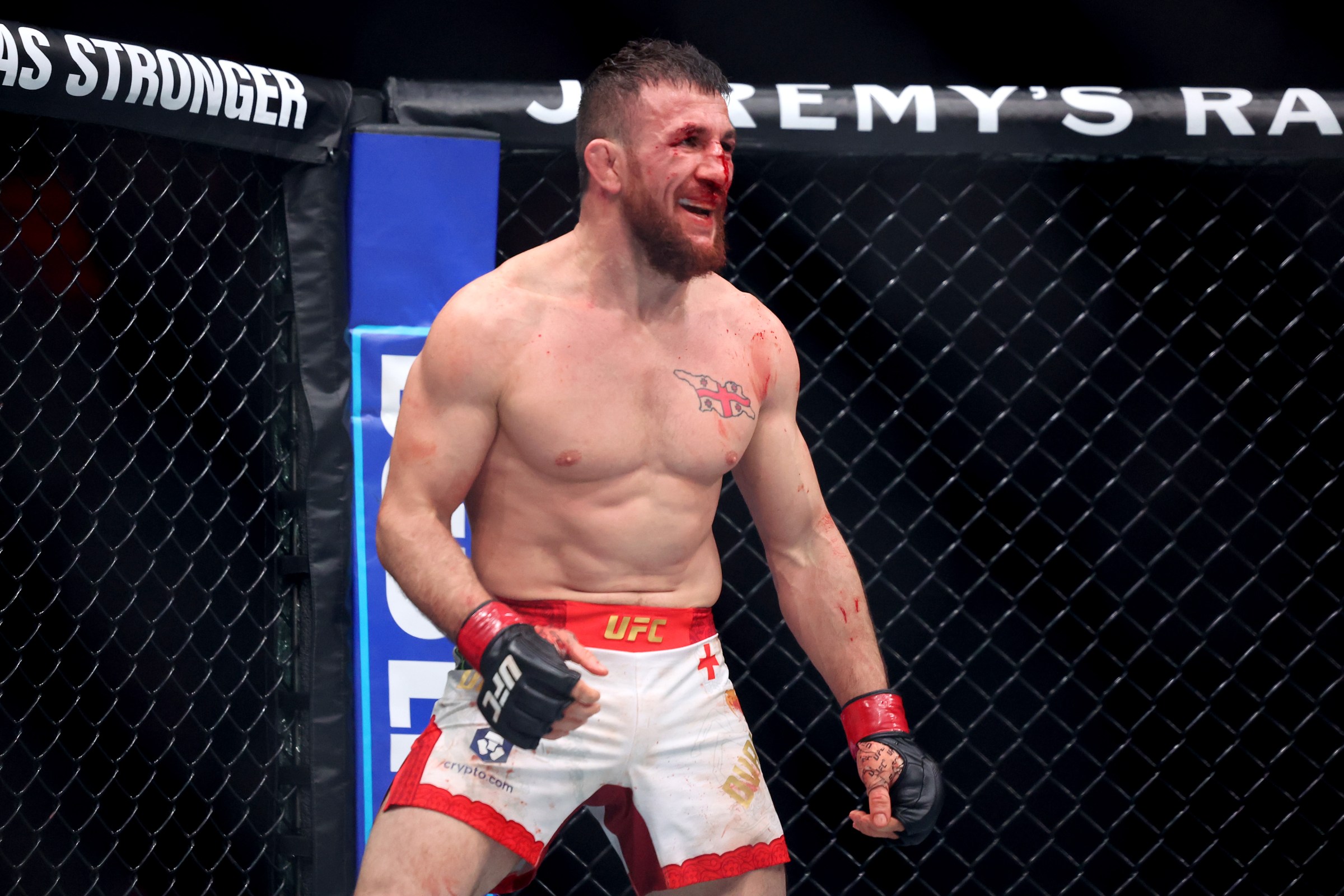 LAS VEGAS, NEVADA - DECEMBER 06: Merab Dvalishvili of Georgia reacts against Petr Yan in a bantamweight title bout during UFC 323 at T-Mobile Arena on December 06, 2025 in Las Vegas, Nevada. (Photo by Ian Maule/Getty Images)