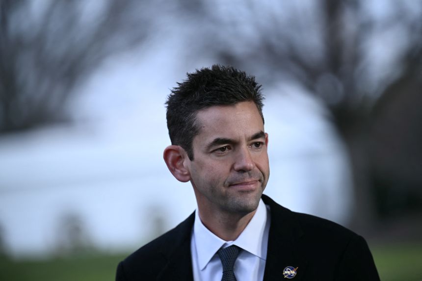 NASA Administrator Jared Isaacman walks outside the White House in Washington in December.