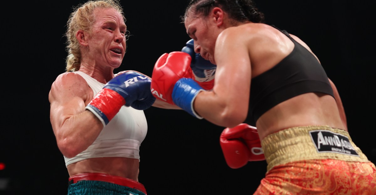 Bloody Clash Of Heads Ends Holm’s Title Bid