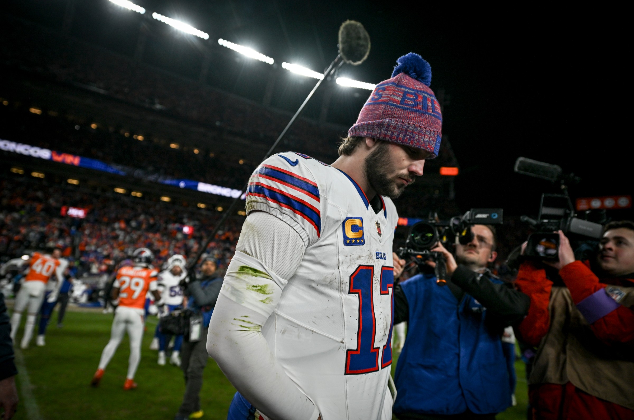 DENVER , CO - JANUARY 17: Josh Allen (17) of the Buffalo Bills walks on the field after the Denver Broncos’ 33-30 overtime win at Empower Field at Mile High in Denver, Colorado on Saturday, January 17, 2026. (Photo by AAron Ontiveroz/The Denver Post)