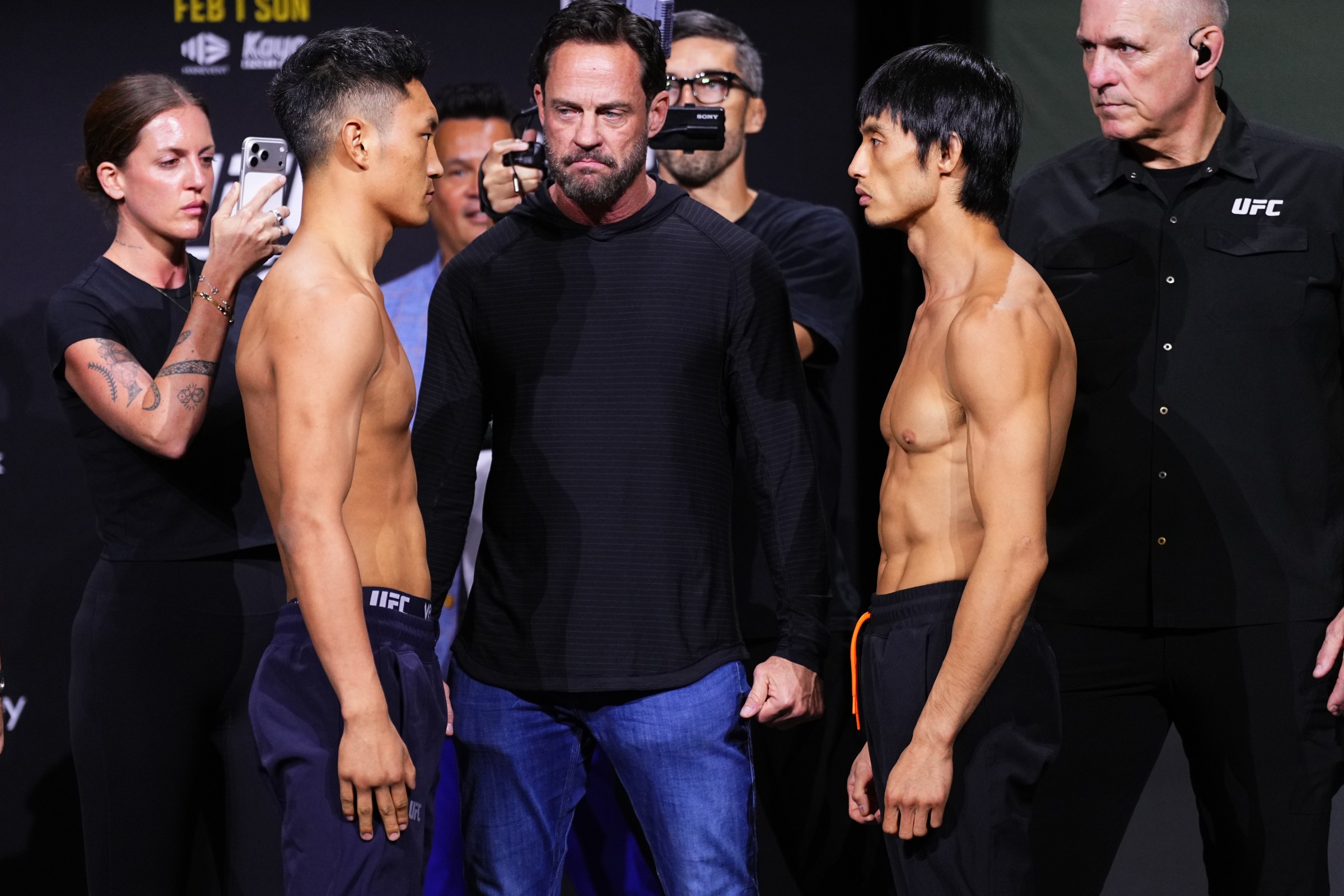 SYDNEY, AUSTRALIA - JANUARY 30: (L-R) Opponents Sulangrangbo of China and Lawrence Lui of China face off during the UFC 325 Ceremonial Weigh-in at Qudos Bank Arena on January 30, 2026 in Sydney, Australia. (Photo by Jeff Bottari/Zuffa LLC)