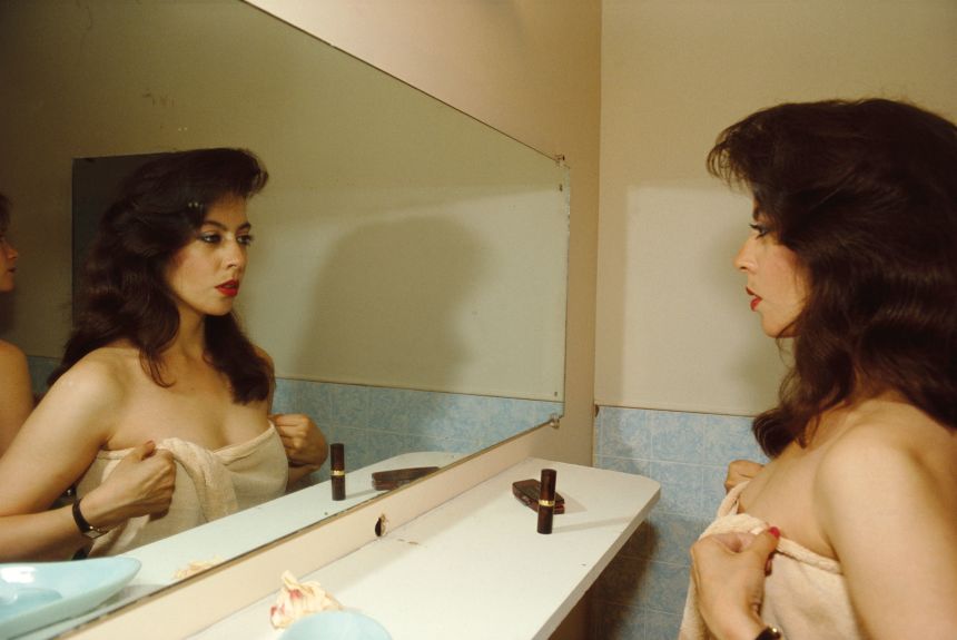 Nan Goldin <em>Sandra in the mirror, New York City </em>(1985) from “The Ballad of Sexual Dependency,” 1973–86, 126 archival pigment prints, in frames, each: 15 3/4 × 11 × 1 1/8 inches (40 × 27.9 × 2.9 cm), overall dimensions variable, edition of 10