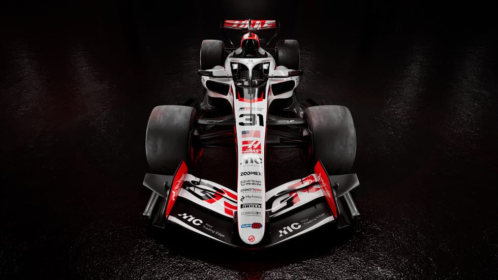 formula 1 race car on a dark reflective surface