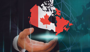 map of Canada with a hand underneath