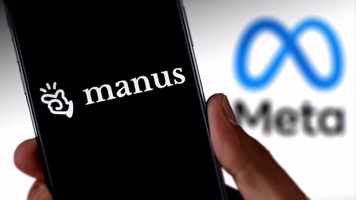 The Manus logo is shown on a smartphone screen, with the Meta logo blurred in the background.