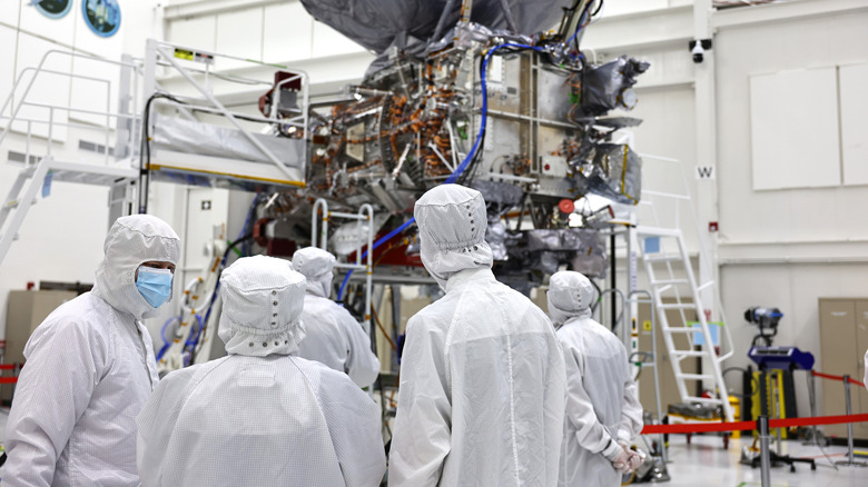 Engineers in scrubs at a NASA clean room at the Jet Propulsion Laboratory