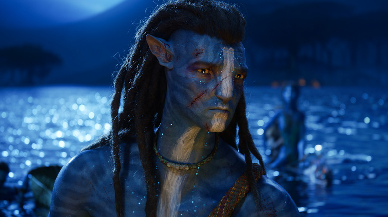 Sam Worthington as Jake Sully sitting on the water in Avatar: The Way of Water