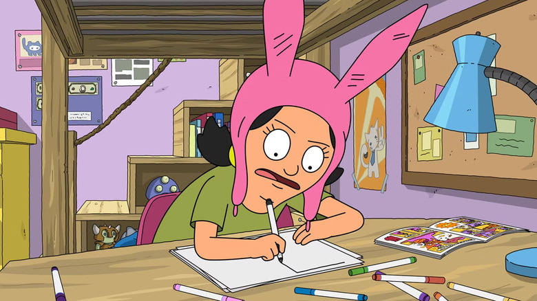 Louise Belcher at desk drawing with a marker in "Bob's Burgers"