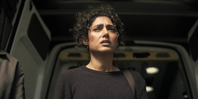 Aneesha looks up at something off-camera with concern in Invasion, Season 3, Episode 5.