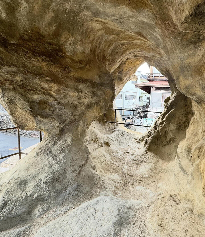 irregular voids reveal cave-like, geological interior inside japanese residence