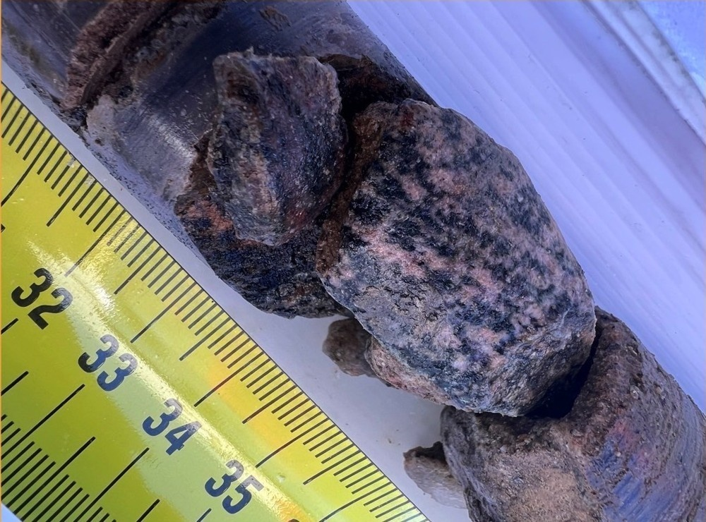 A core of bedrock and sediment pulled up from 300 feet below the Greenland Ice Sheet near the edge of Prudhoe Dome.