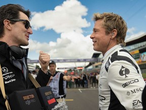 Director Joseph Kosinski and Brad Pitt on the set of 'F1: The Movie,' now streaming on Apple TV.