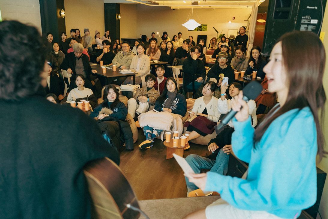 The Seoul Morning Coffee Club also hosts coffee chat groups, morning runs and book clubs. Park Jihyun, right, volunteers here as host of a morning coffee chat.
