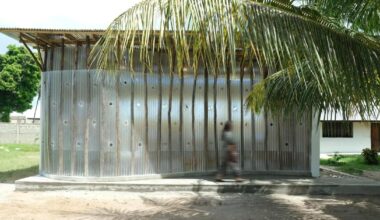 perforated corrugated panels regulate light and ventilation at library in tanzania