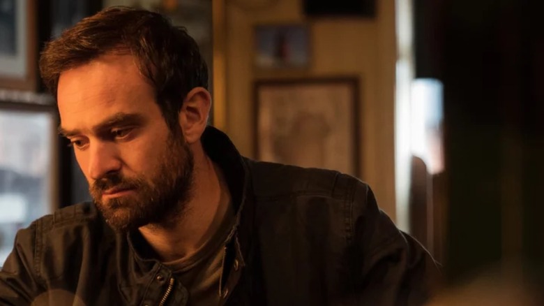 Charlie Cox as Michael Kinsella looking down in Kin