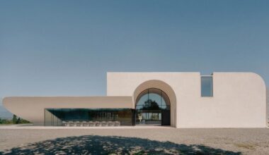 arches and voids carve winery’s monolithic white facade in georgia