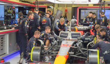 Red Bull mechanics work on Liam Lawson's RB21