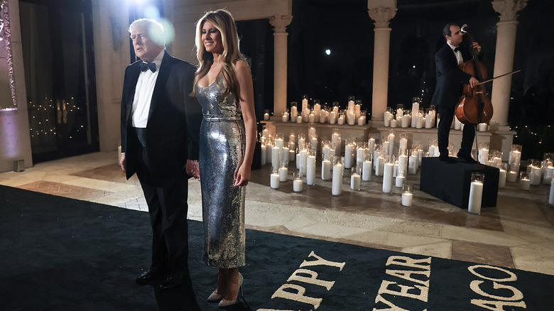 Donald and Melania Trump holding hands
