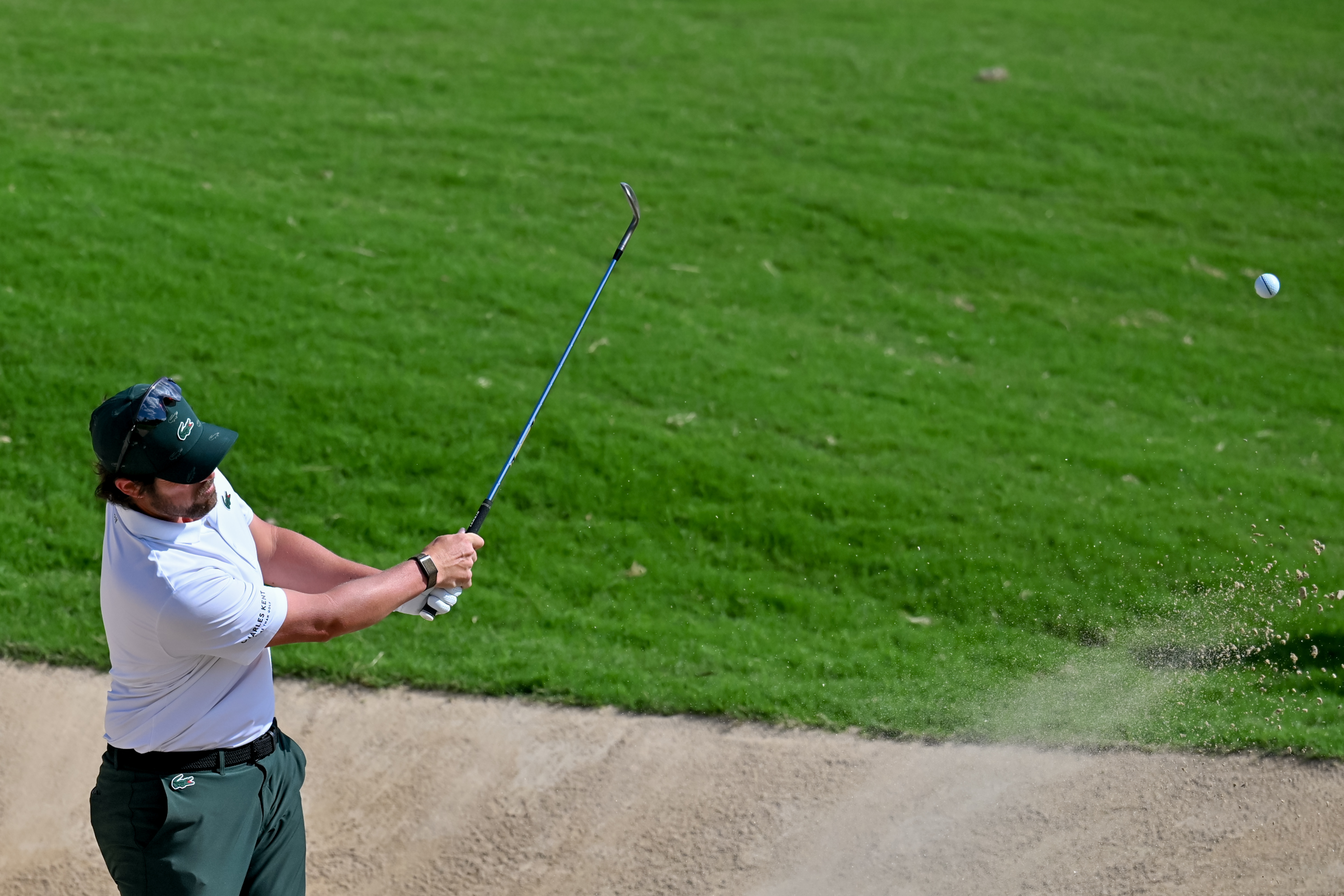 Nacho Elvira hits a bunker shot