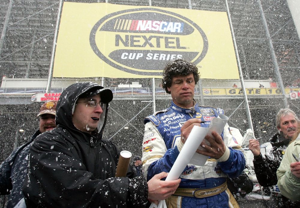 Michael Waltrip signs autographs in the snow