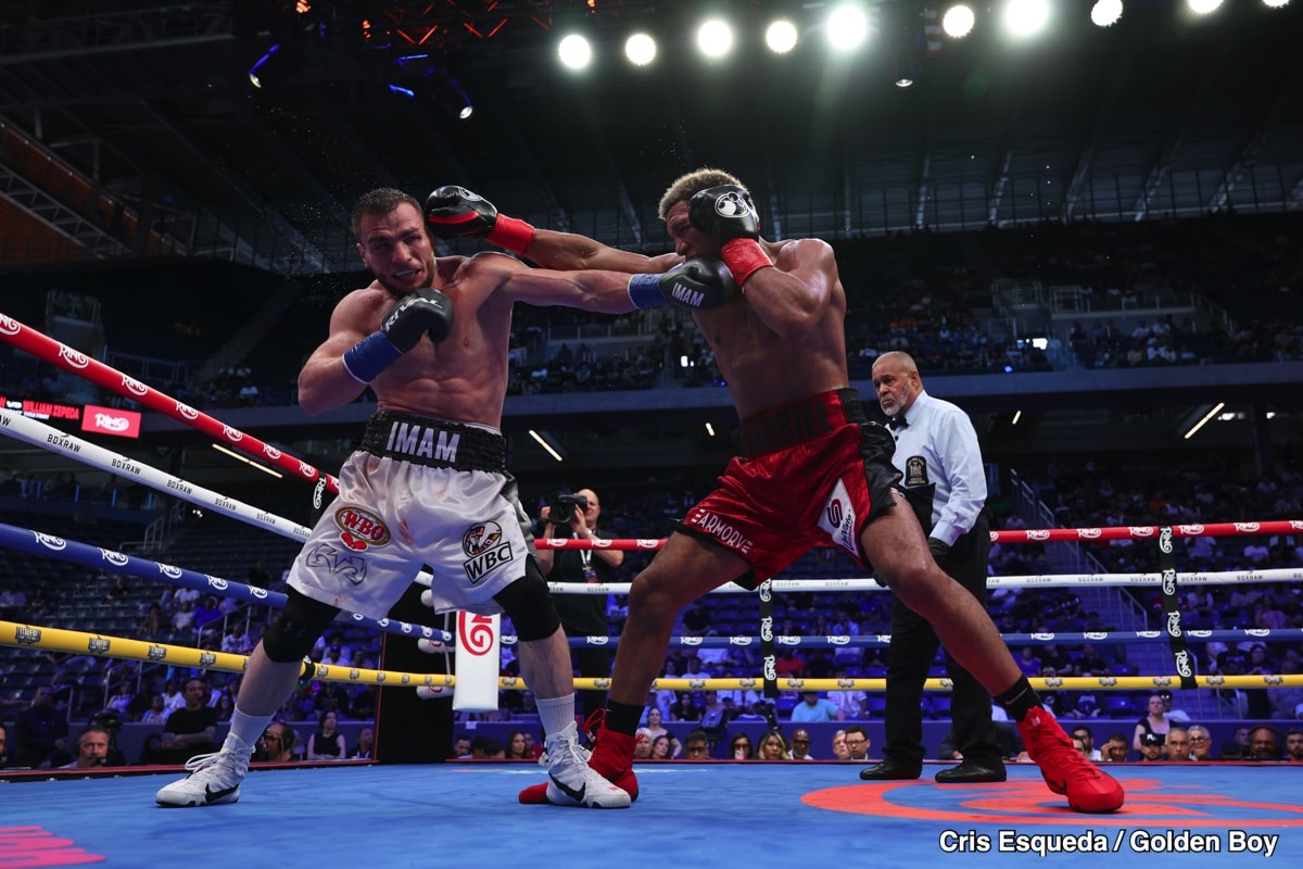David Morrell exchanges punches with Imam Khataev during their light heavyweight bout on July 12 2025 at Louis Armstrong Stadium in Queens New York.