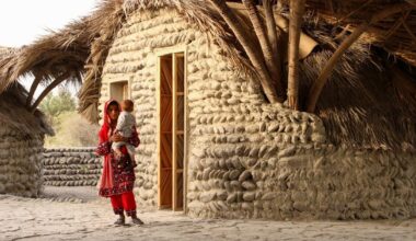 vaulted palm canopy shields dry stone guesthouse cluster in iran
