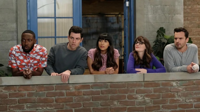 Winston Bishop (Lamorne Morris), Schmidt (Max Greenfield), Cece (Hannah Simone), Jess (Zooey Deschanel) and Nick (Jake Johnson) looking out on a ledge in New Girl