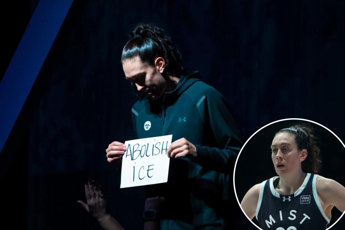 Liberty star Breanna Stewart holds 'abolish ICE' sign before Unrivaled game