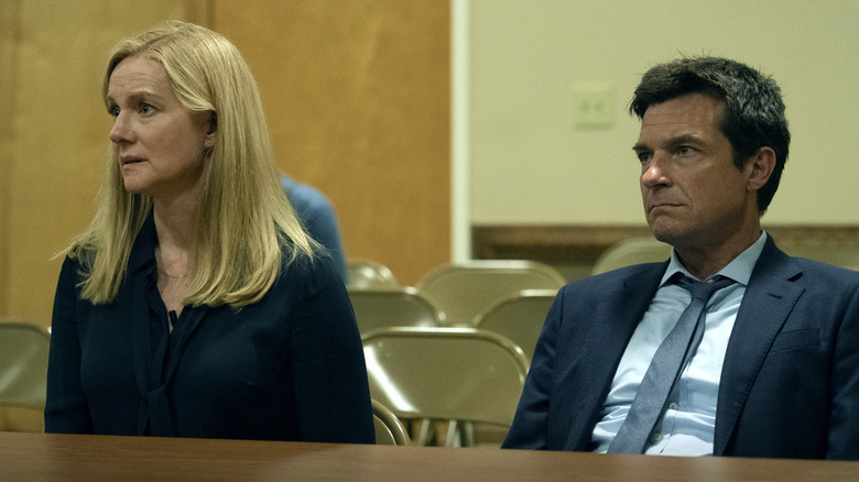 Marty and Wendy Byrde (Jason Bateman and Laura Linney) sit at a table in Ozark