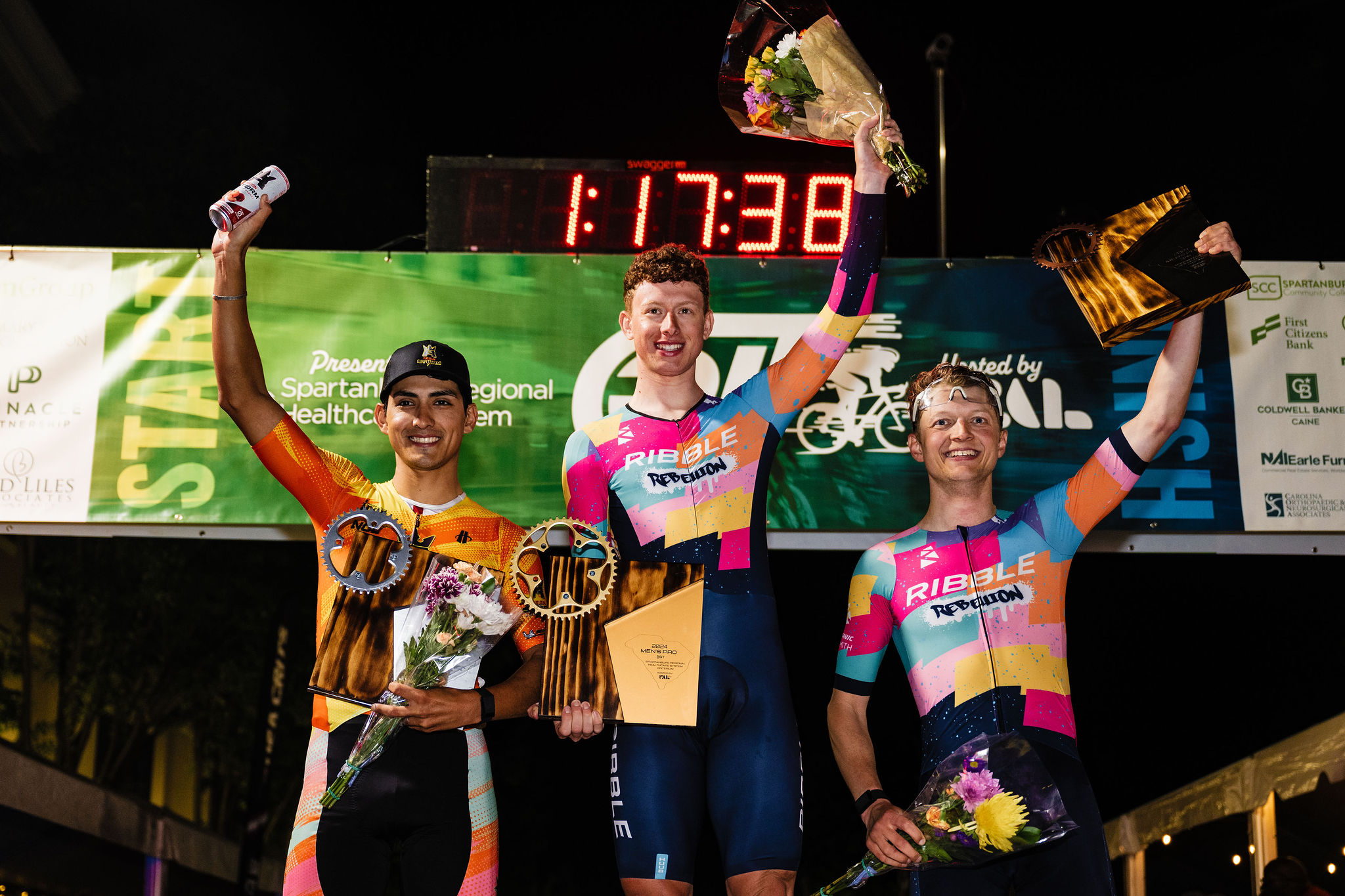 Men's podium at USA Crits stop #3 (L to R): Alfredo Rodriguez second, winner Jim Brown and Al Murison in third