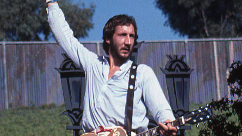 Pete Townshend doing guitar windmill on stage in 1976