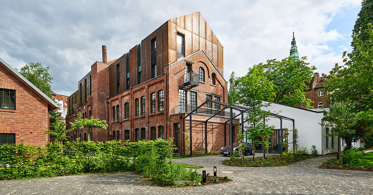 corten steel extends former laundry complex’s brick buildings in kassel