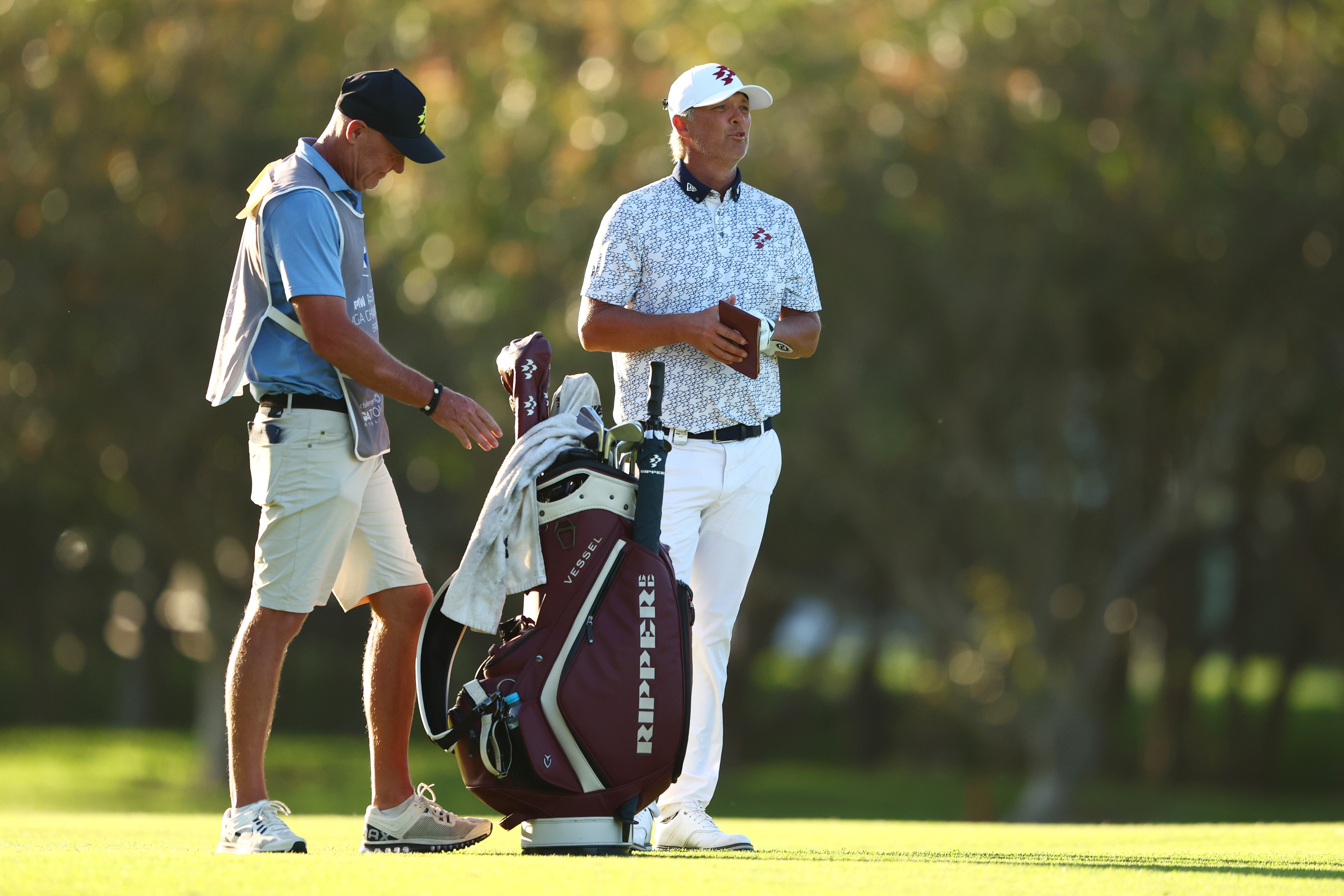 Matt Jones speaks to his caddie