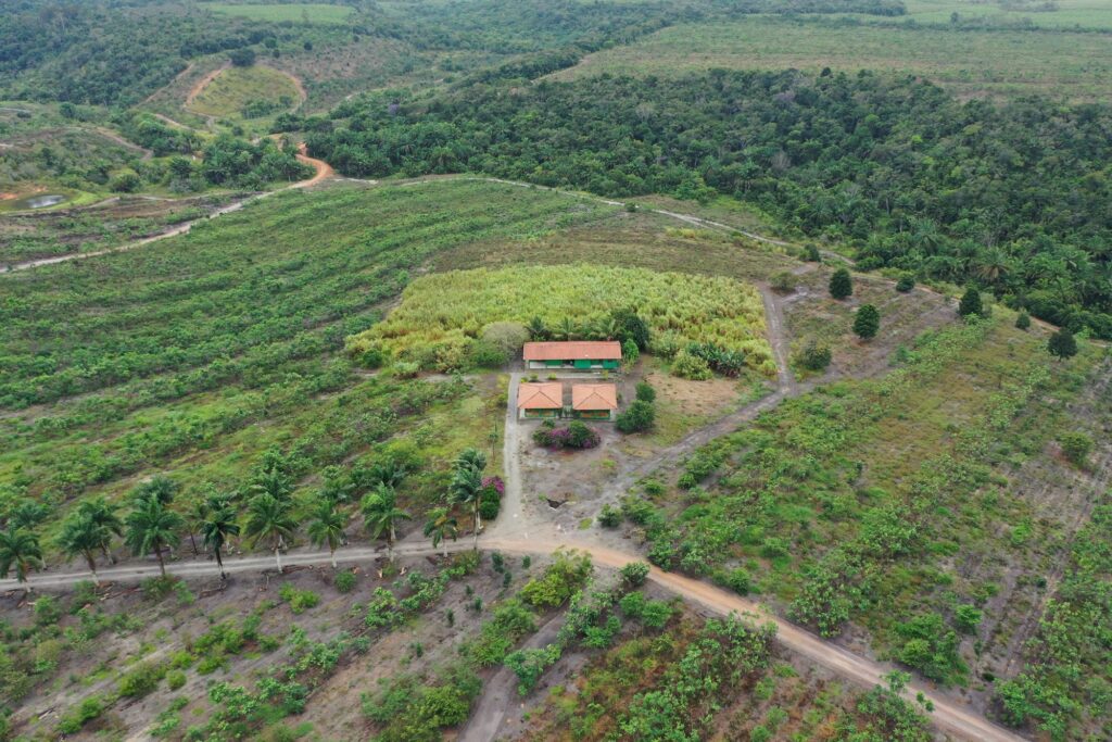 An overhead shot of several fields intersected by dirt roads.