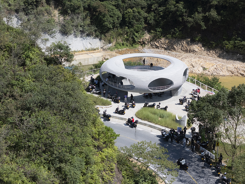 tubular concrete ring by HCCH studio shapes cycling rest pavilion among chinese hills