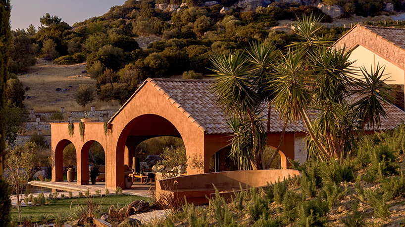 lime-washed facade in terracotta tones enfolds urla family home in turkey