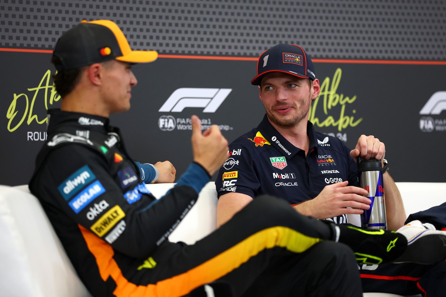 Pole position qualifier Max Verstappen of the Netherlands and Oracle Red Bull Racing and Second placed qualifier Lando Norris of Great Britain and McLaren talk in the Drivers Press Conference during qualifying ahead of the F1 Grand Prix of Abu Dhabi at Yas Marina Circuit on December 06, 2025 in Abu Dhabi, United Arab Emirates. (Photo by Bryn Lennon/Getty Images) // Getty Images / Red Bull Content Pool //