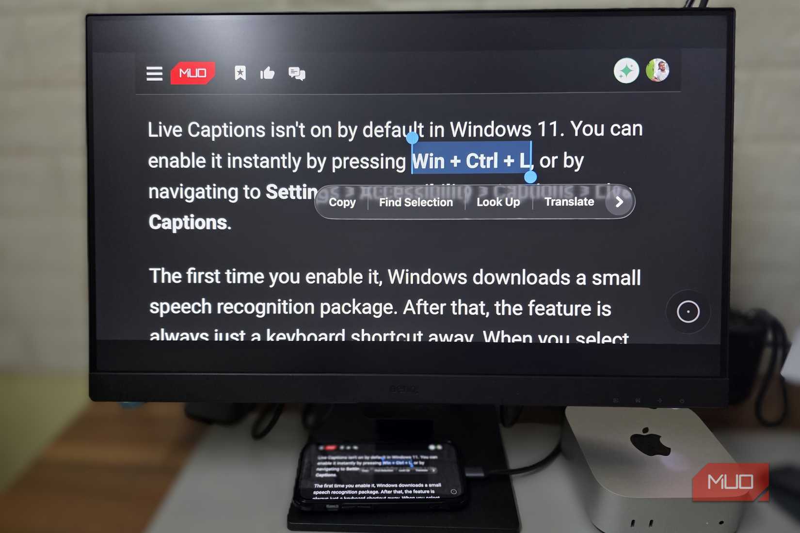 Selecting and copying text on a phone mirrored to a monitor.