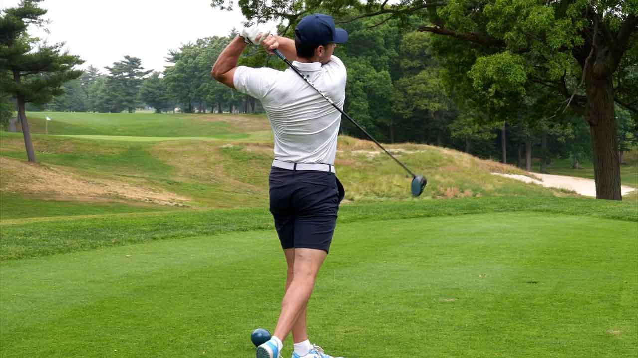 Shane Pinto takes a drive off a tee at Bethpage Black in New York. (Ben Coles/Ottawa Senators)