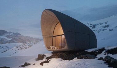high-altitude cottage emerges like a rock from georgian mountains