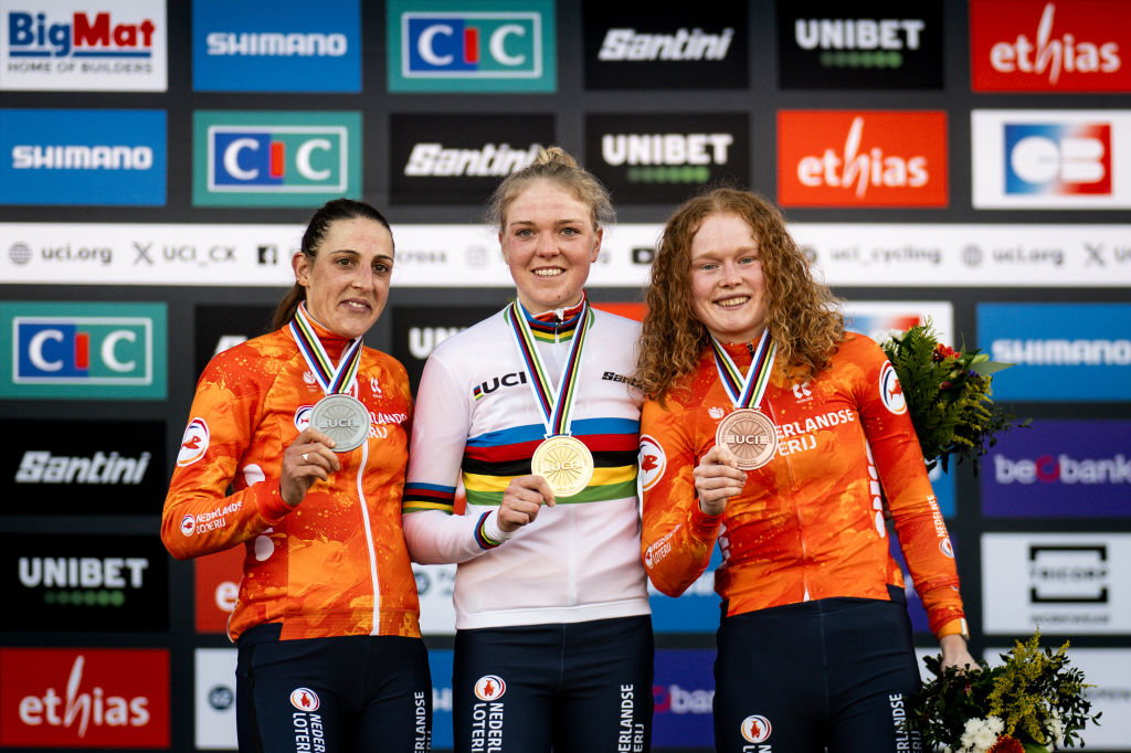 LIEVIN, FRANCE - FEBRUARY 01: Silver medalist Lucinda Brand of Netherlands, gold medalist Fem Van Empel of Netherlands and bronze medalist Puck Pieterse of Netherlands pose on the podium during the medal ceremony after the 76th UCI Cyclo-Cross World Championships 2025 - Women&amp;apos;s Elite on February 01, 2025 in Lievin, France. (Photo by Billy Ceusters/Getty Images)