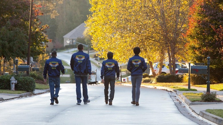 The neighborhood watch walking down the street