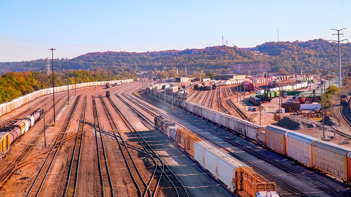 A high vantage viewpoint of a large-scale commercial inland cargo container and railroad yard in Cincinnati Ohio.