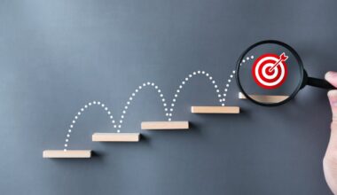 A bullseye jumping up stairs with a magnifying glass on it.